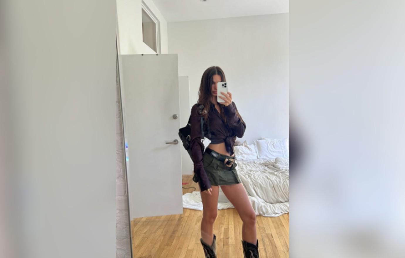 Emily Ratajkowski shows off her bombshell figure in strapless grey dress  and tan boots as she leaves her High/Low podcast studio - one month after  show was canceled