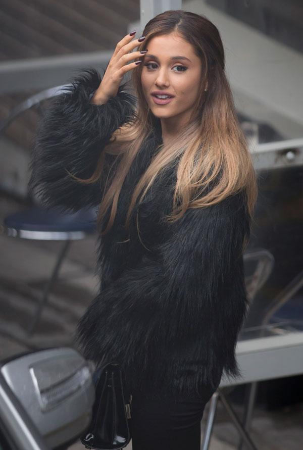 Ariana fixing hair