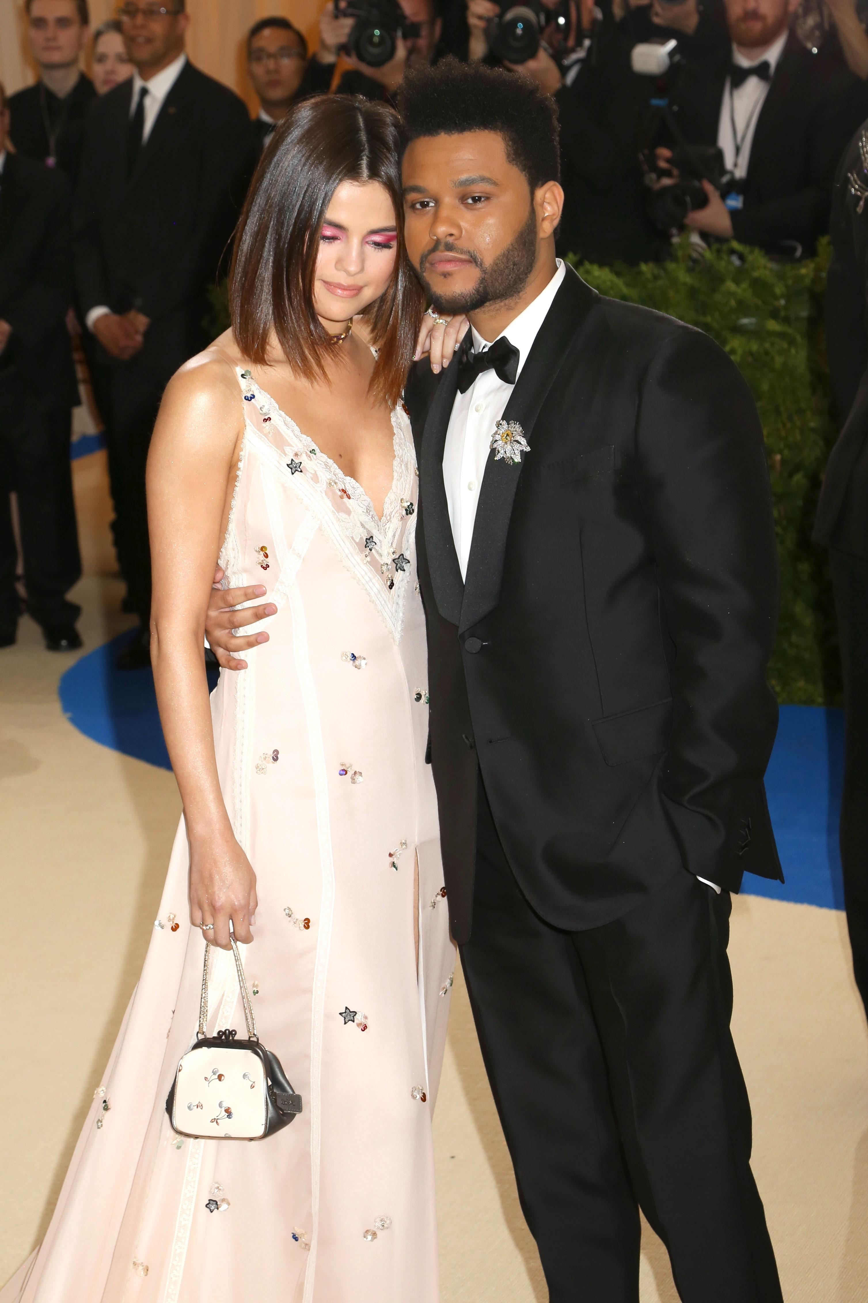 The Weeknd and Selena Gomez share the PDA at Met Gala