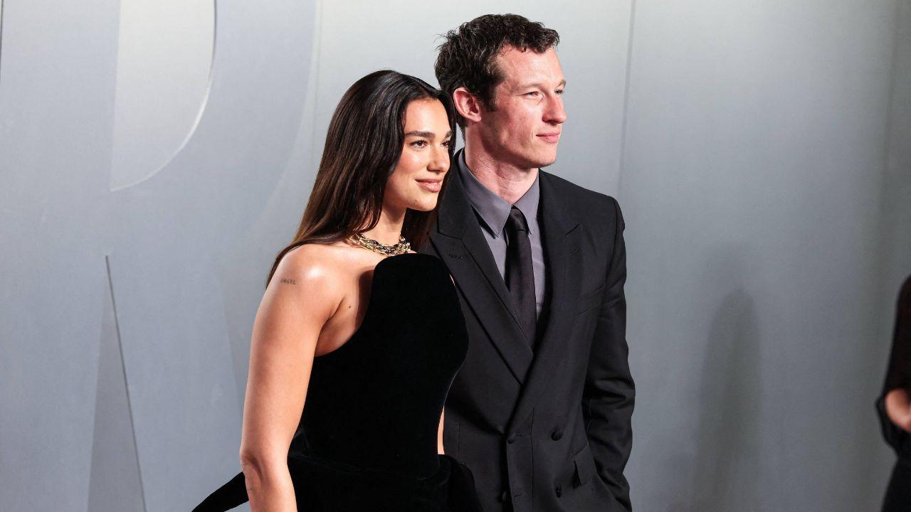 Image of Dua Lipa stunned in a custom black Ferragamo gown as she arrived alongside Callum Turner for the 'One Night Only' premiere in New York City.