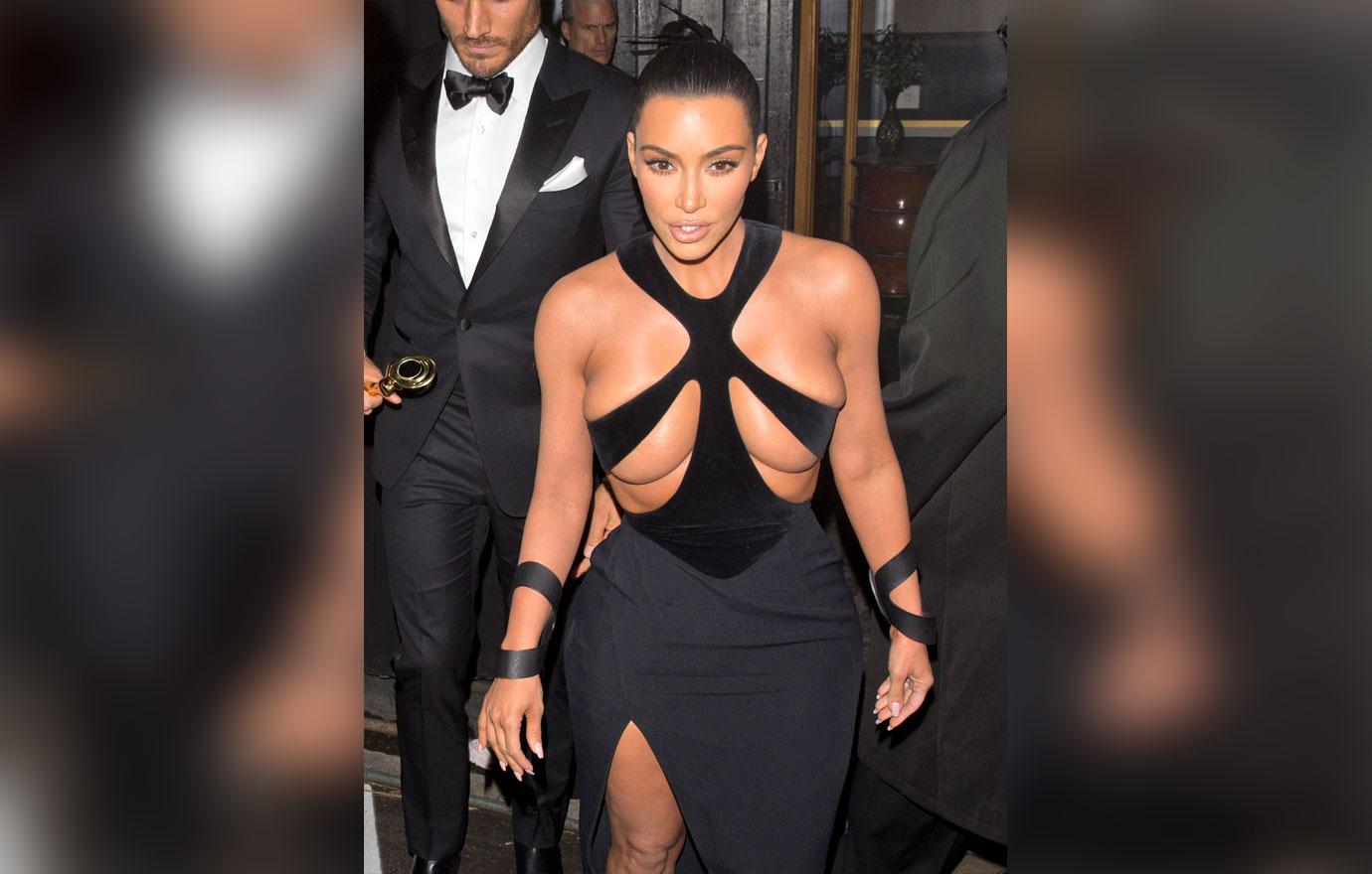 Kim Kardashian wears a 'Barely There' dress as she was seen leaving 'The Avalon' in Hollywood with her British Hair Stylist Chris Appleton who was looking sharp in a Tuxedo and holding a Gold award