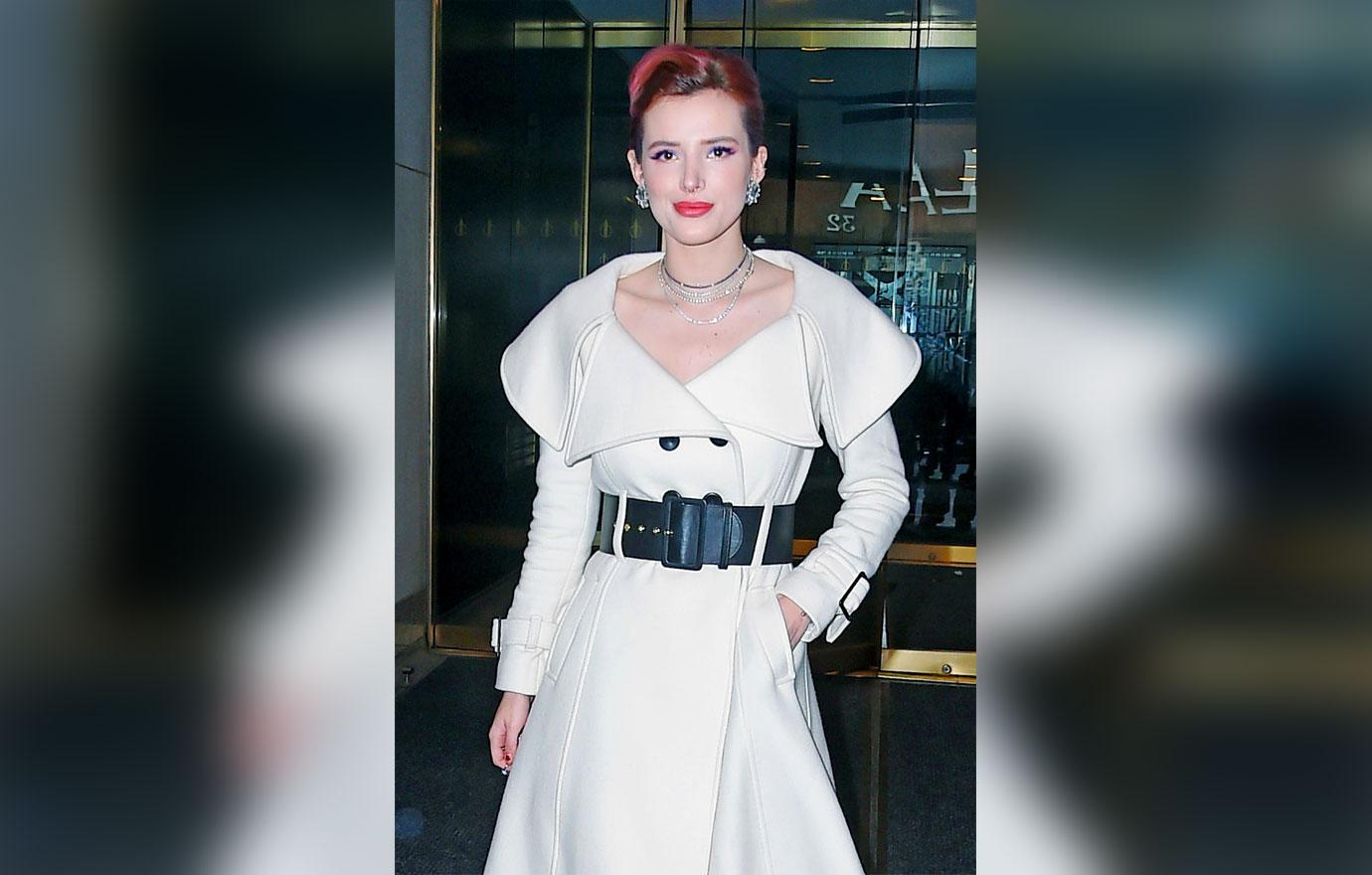 Bella Thorne looks angelic in a white trench coat