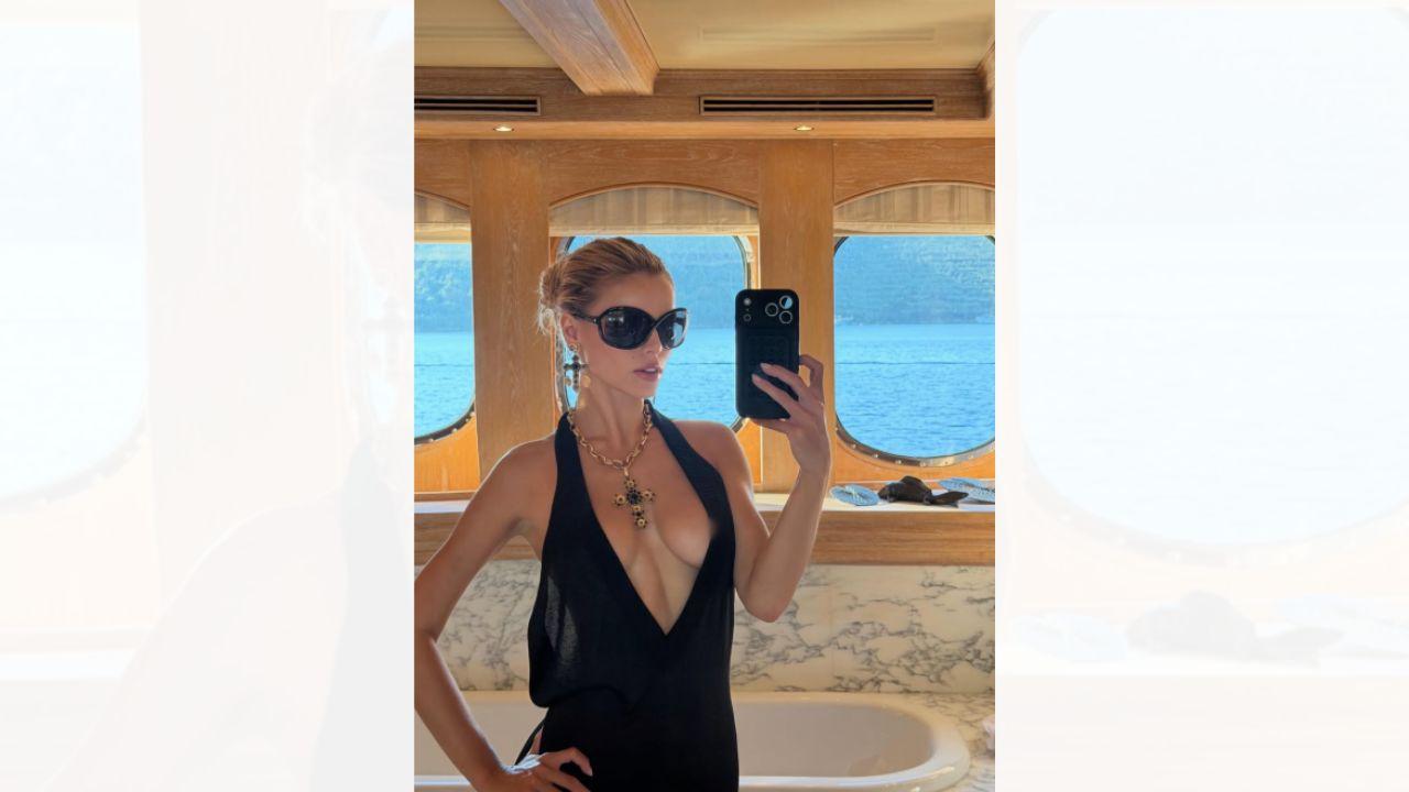 Image of Brooks Nader ditched her bathing suit top in front of her family. 