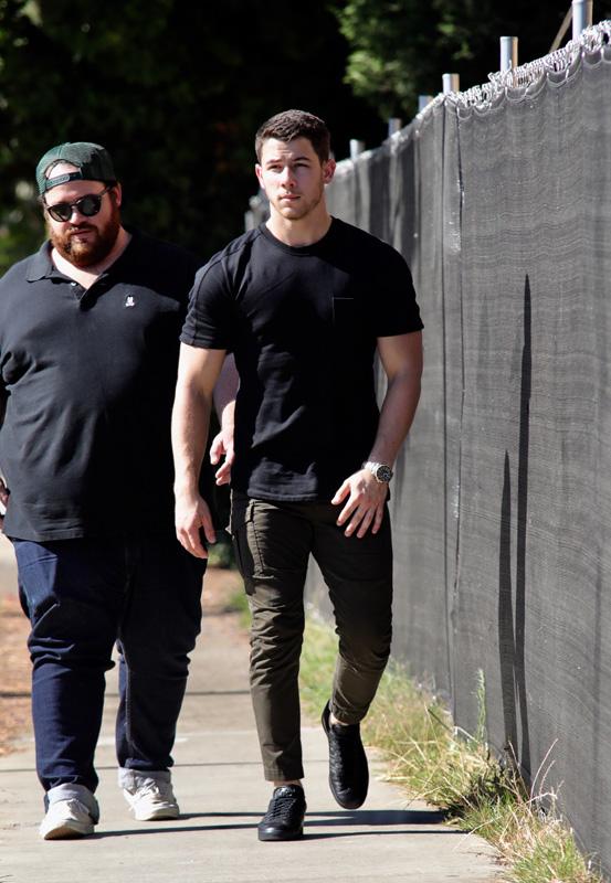 EXCLUSIVE: Nick Jonas looking ripped in a black t shirt