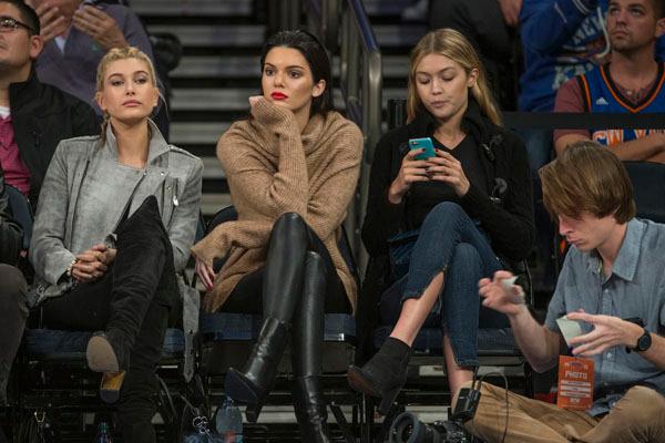 Kendall Jenner sits court side during NY Knicks game at Madison Square Garden with with Hailey Baldwin and Gigi Hadid