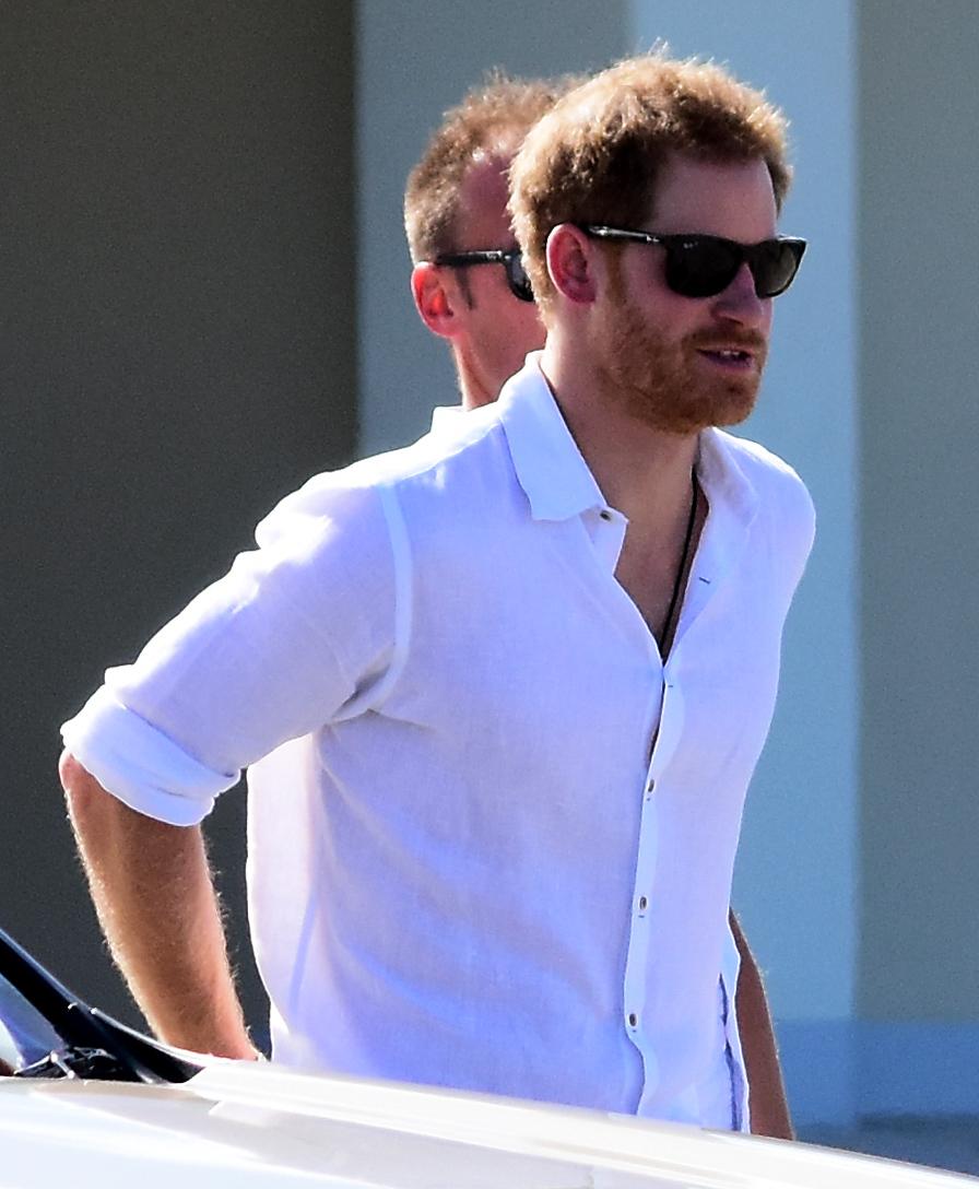 Prince Harry pictured boarding a boat in Barbuda to see the Frigate birds throughout the mangroves