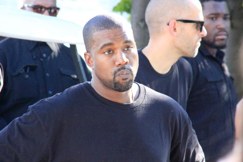 Kanye West seen helping model walk during his Yeezy Fashion Show in