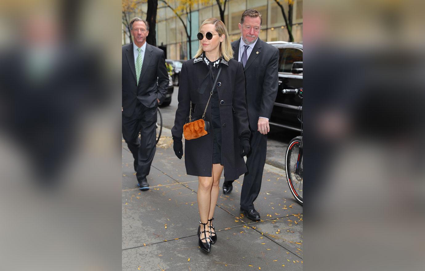 Ashley tisdale walking in black trenchcoat