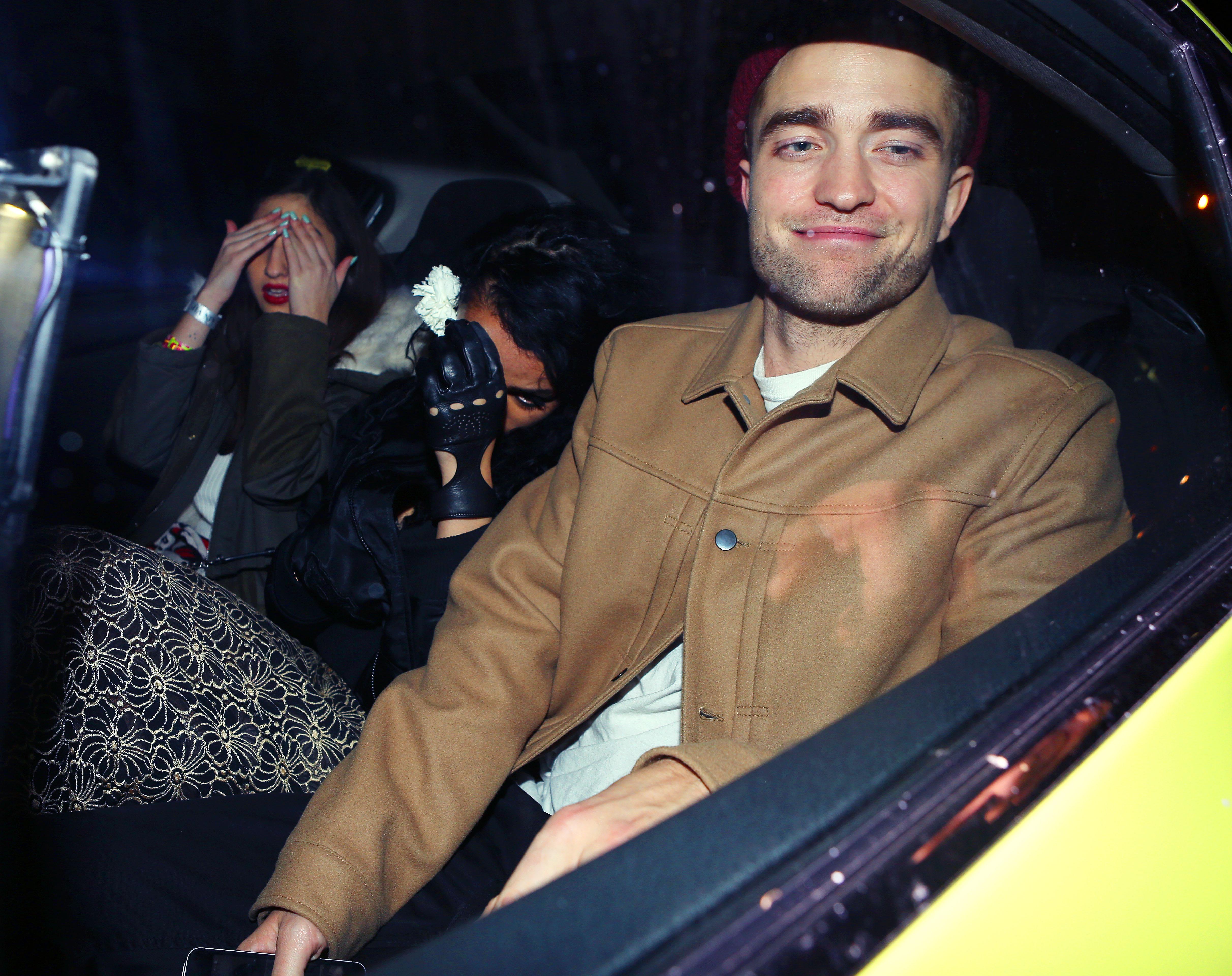 Robert Pattinson and girlfriend FKA Twigs take a cab after a night of clubbing