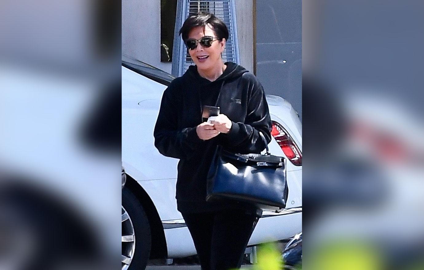 Kris Jenner is all smiles as she leaves the Peninsual Hotel