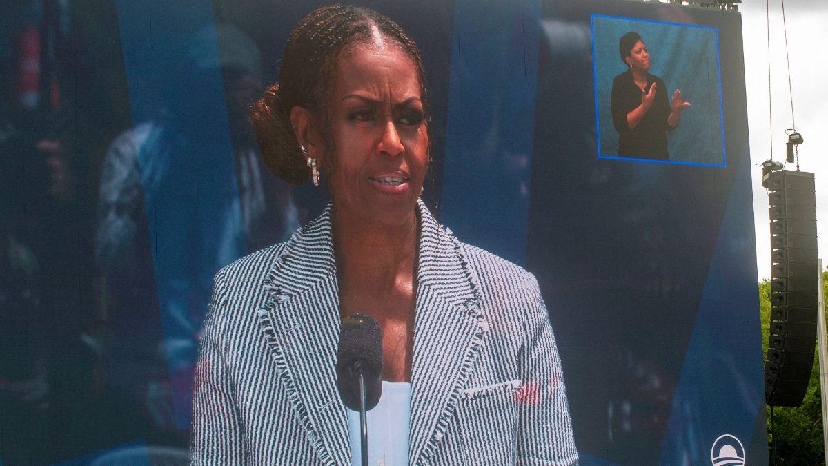 Image of Michelle Obama listed Barack Obama's achievements.