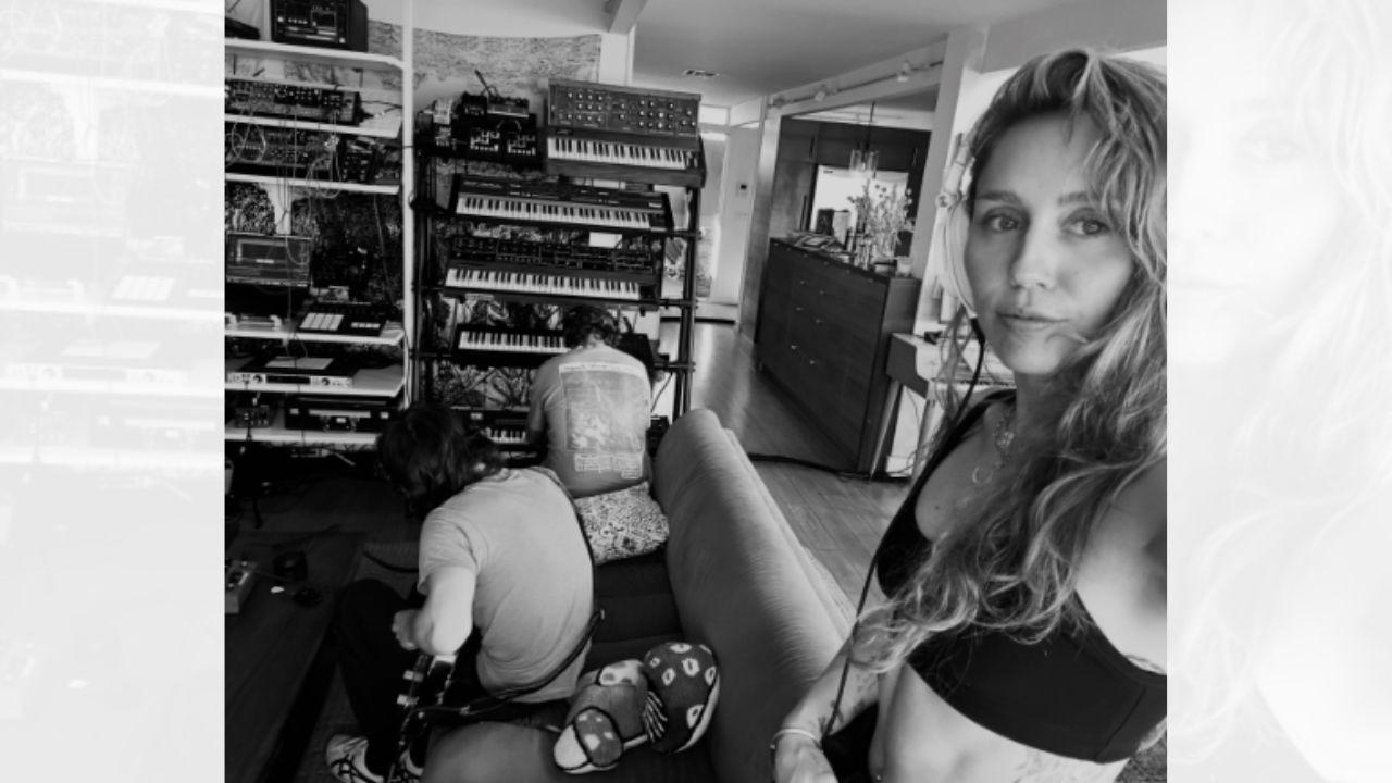 Image of Miley Cyrus wore a sports bra for the selfie alongside her fiancé, Maxx Morando. 