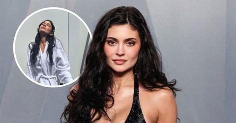 Image of Kylie Jenner posed outside in nothing but her robe.