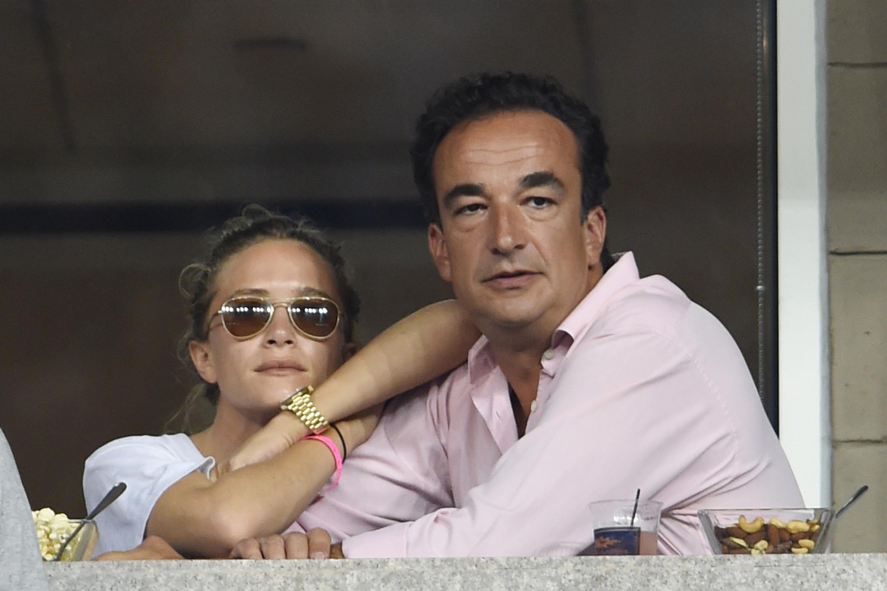 Olivier Sarkozy and Mary Kate Olsen seen on day eight of the 2014 US Open