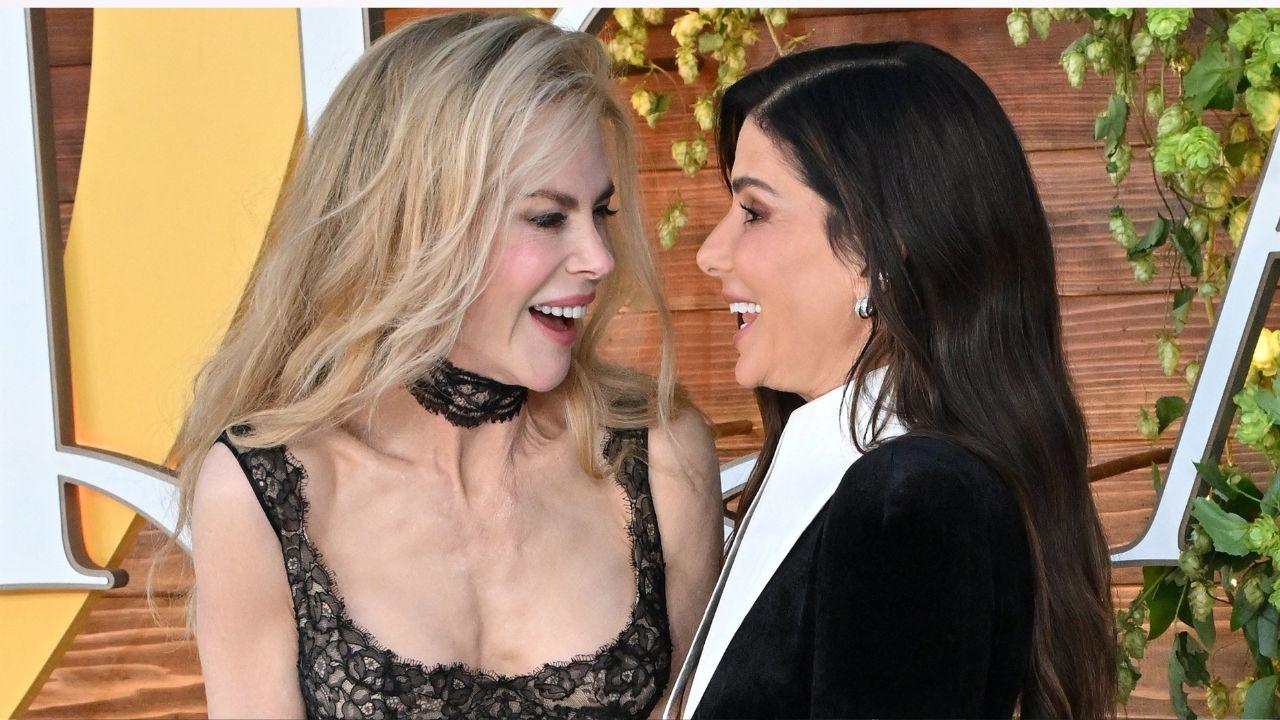 Image of Bullock and Kidman smiling at each other.