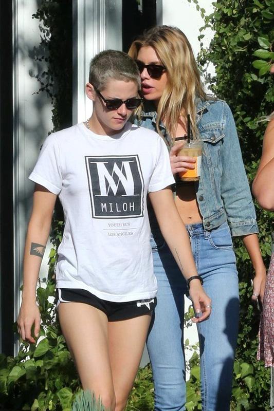 Stella Maxwell whispers sweet things into Kristen Stewart&#8217;s ears