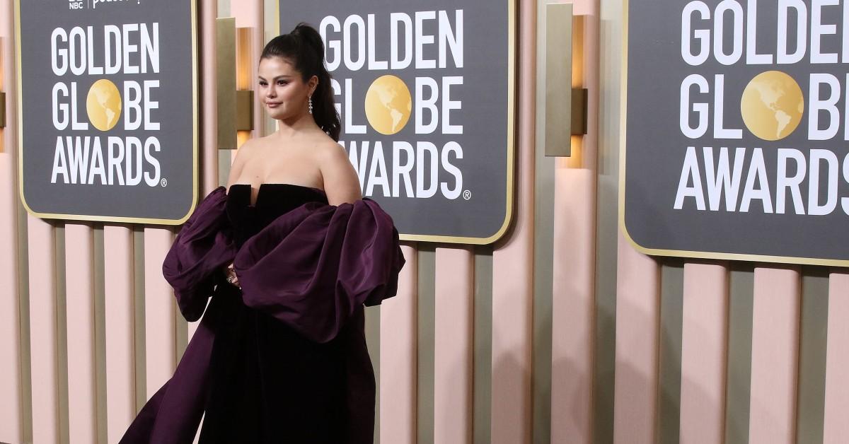 Selena Gomez teases near wardrobe malfunction as she poses in pink bathrobe  for sexy new photo