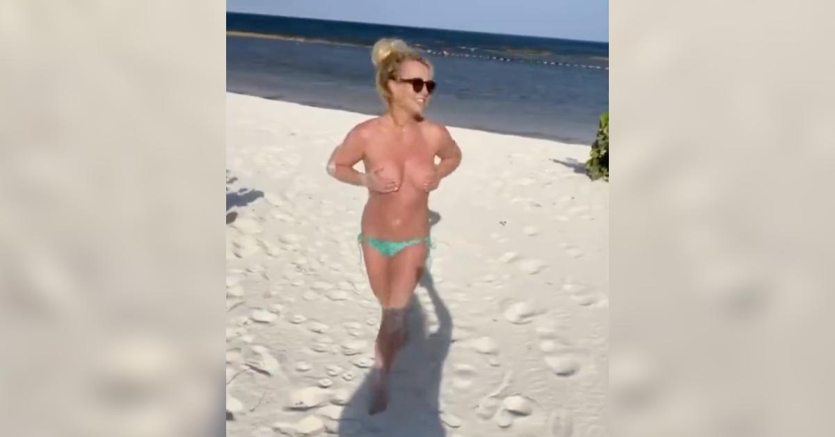 britney spears runs topless falling sand resurfaced viral video watch