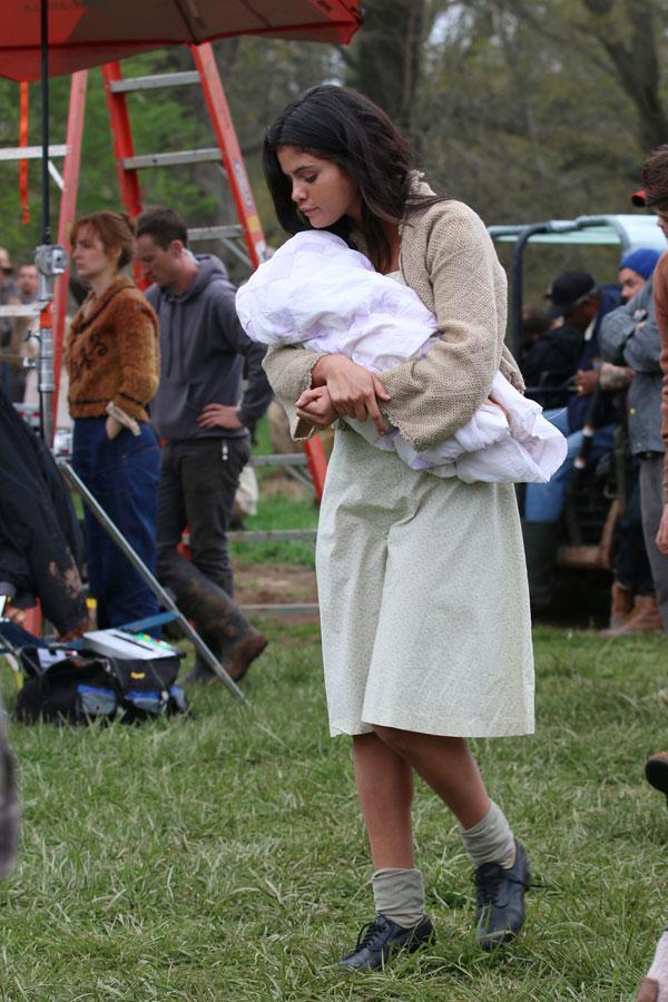 Selena Gomez Holds Baby On Set