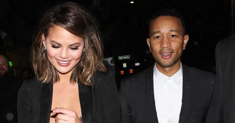 Chrissy Teigen wears a black lace top as she and John Legend celebrate Valentine’s Day by dining at Giorgio Baldi