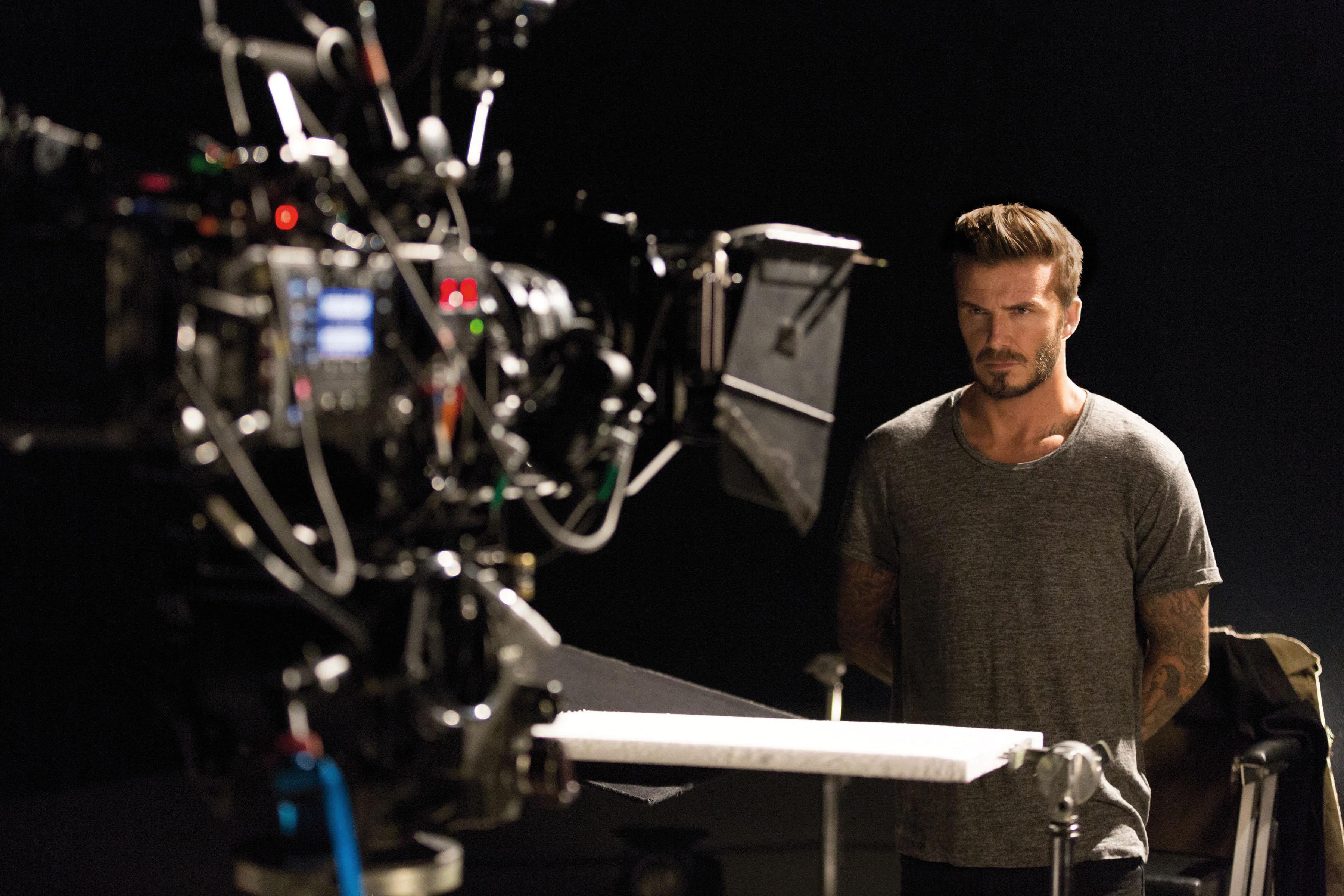 David Beckham goes shirtless in behind the scenes shots from his new fragrance campaign