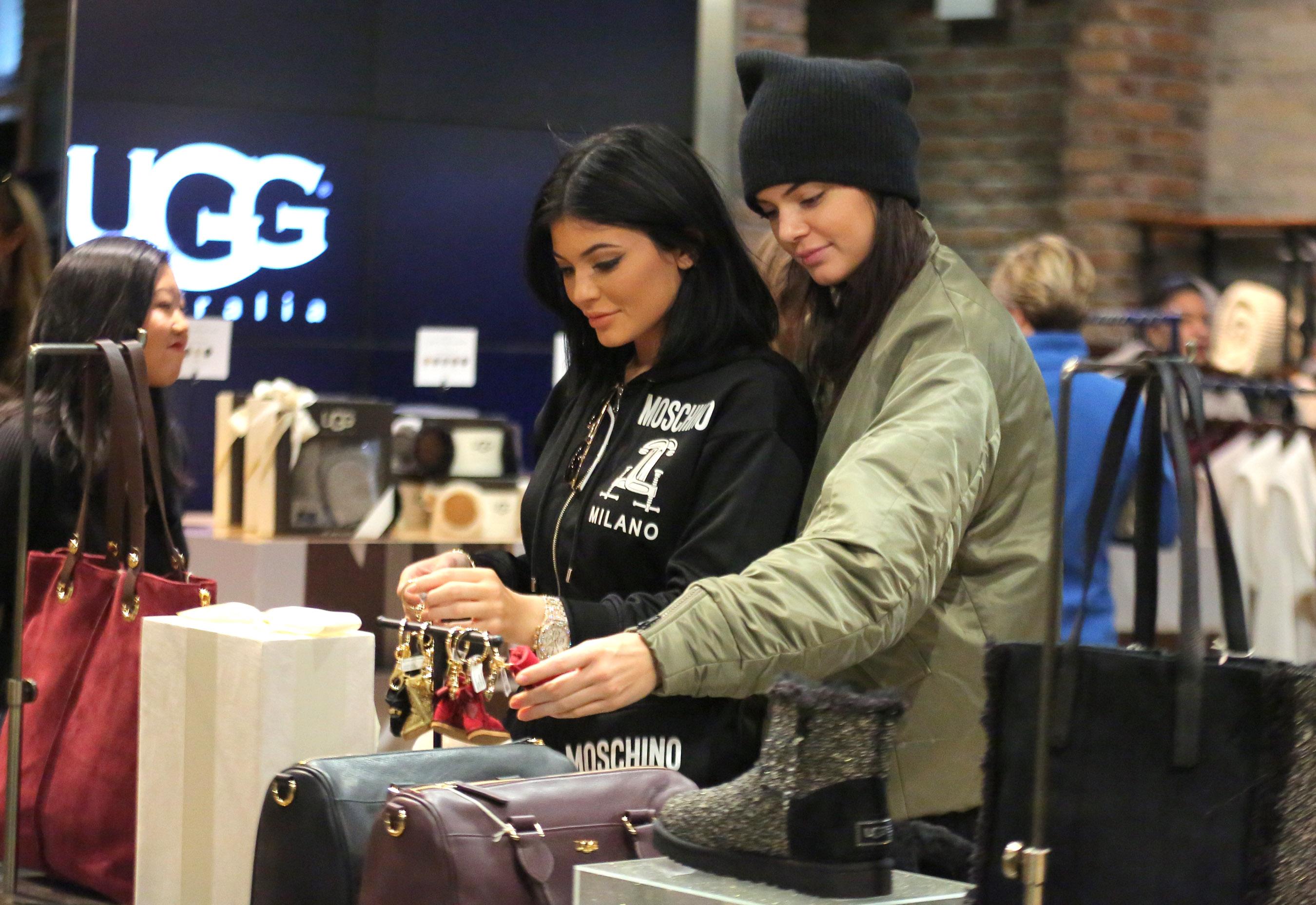 Kylie Jenner and Kendall Jenner show for hats and boots inside the UGG flagship store NYC