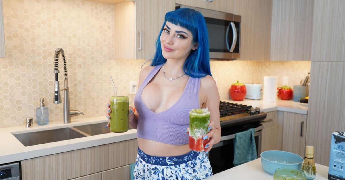 Jewelz Blu shows off her colorful beverages in her kitchen.
