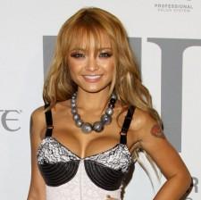 2009__12__wenn_tila1 225×224.jpg