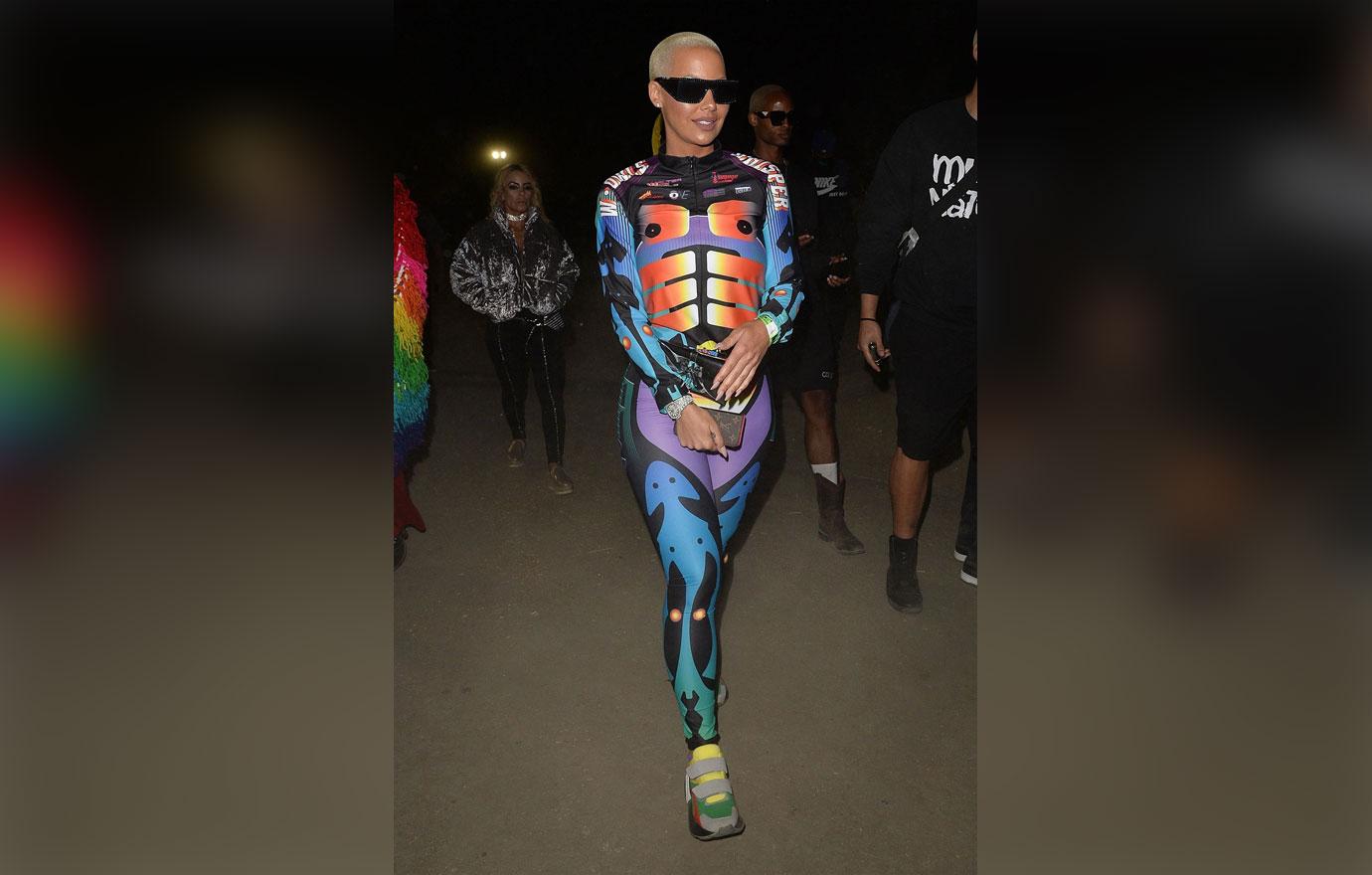 Amber Rose rocks a colorful skin tight suit at the Neon Carnival at Coachella