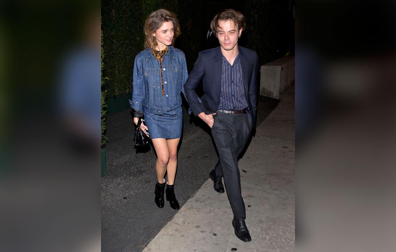 Natalia Dyer and Charlie Heaton hold hands as they leave the &#8216;MIU MIU&#8217; clothing launch in West Hollywood, CA