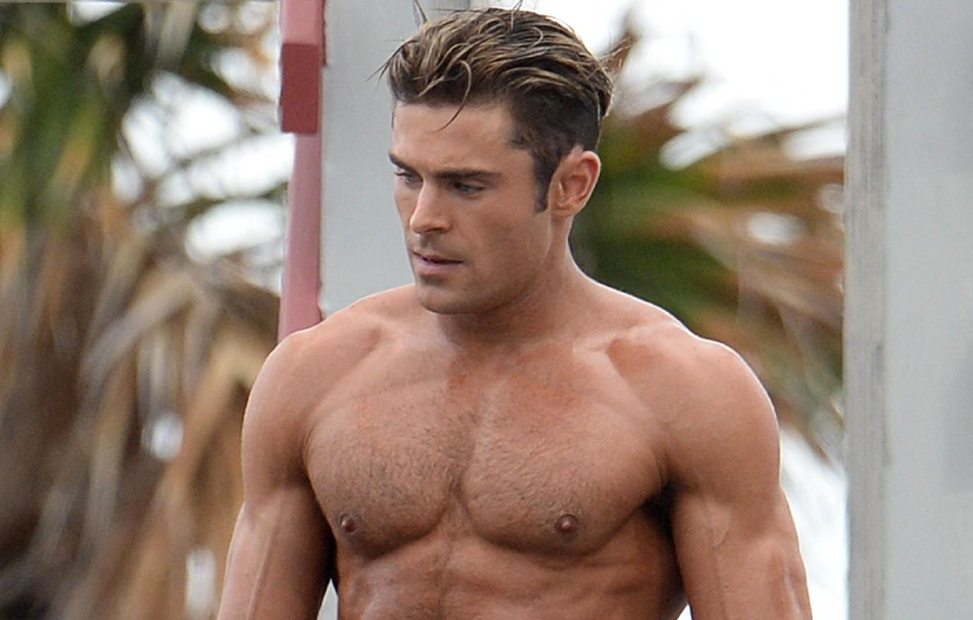 Zac Efron is ripped in tightest pants ever as he covers his