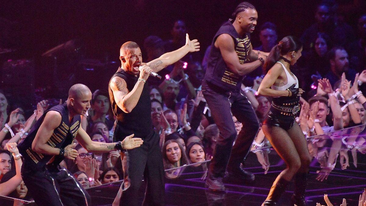 Photo of Ricky Martin's concert was interrupted when someone discharged tear gas near the stage.