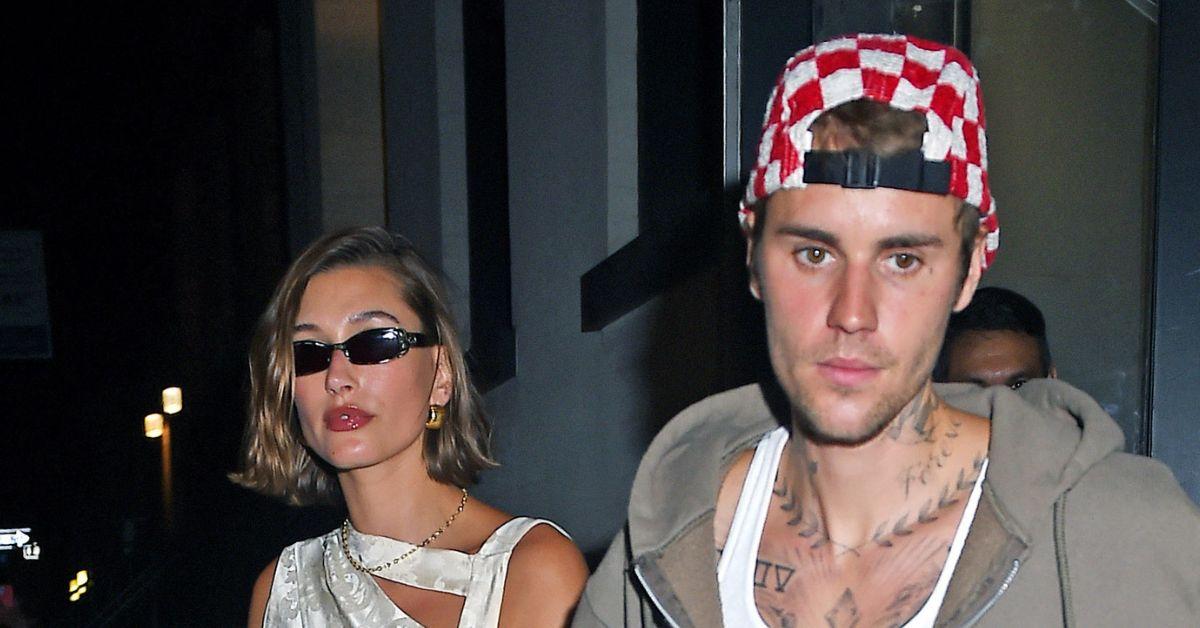 image of Justin Bieber threw a water bottle toward photographers.