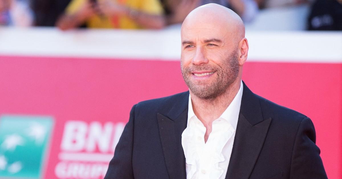 image of John Travolta is open to 'the idea of love again,' a source said. 