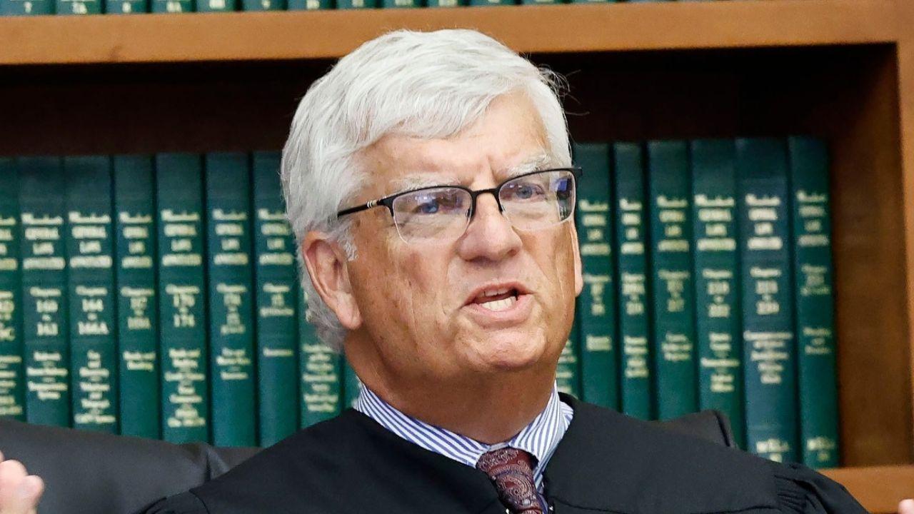 image of She remains charged with murder.
