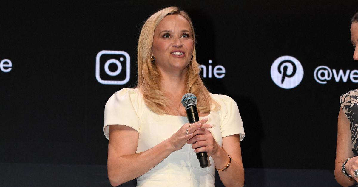 image of In a photo, Oliver Haarmann playfully splashed Reese Witherspoon with a hose.