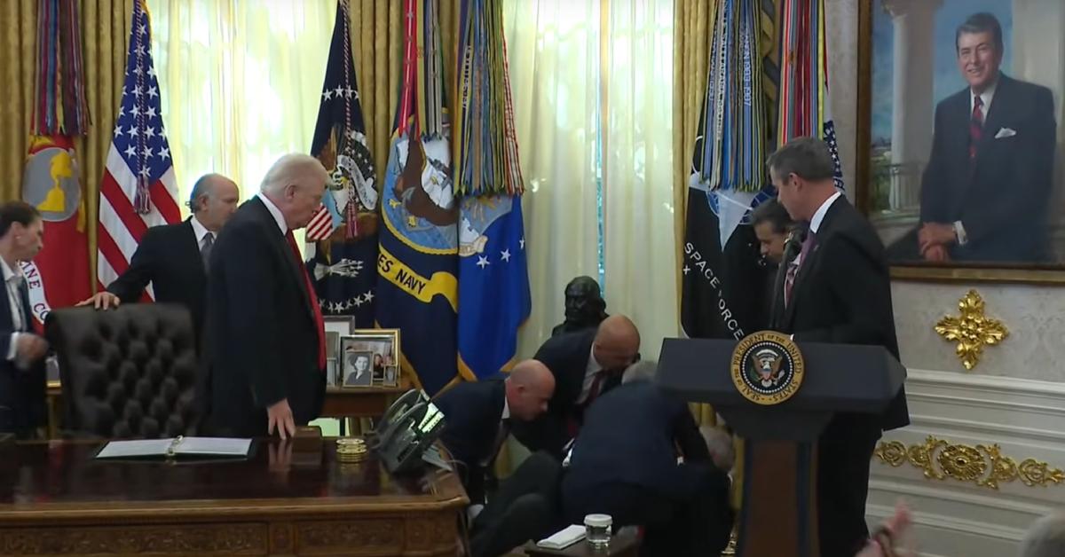 Image of Dr. Mehmet Oz rushed over to help the man who collapsed.