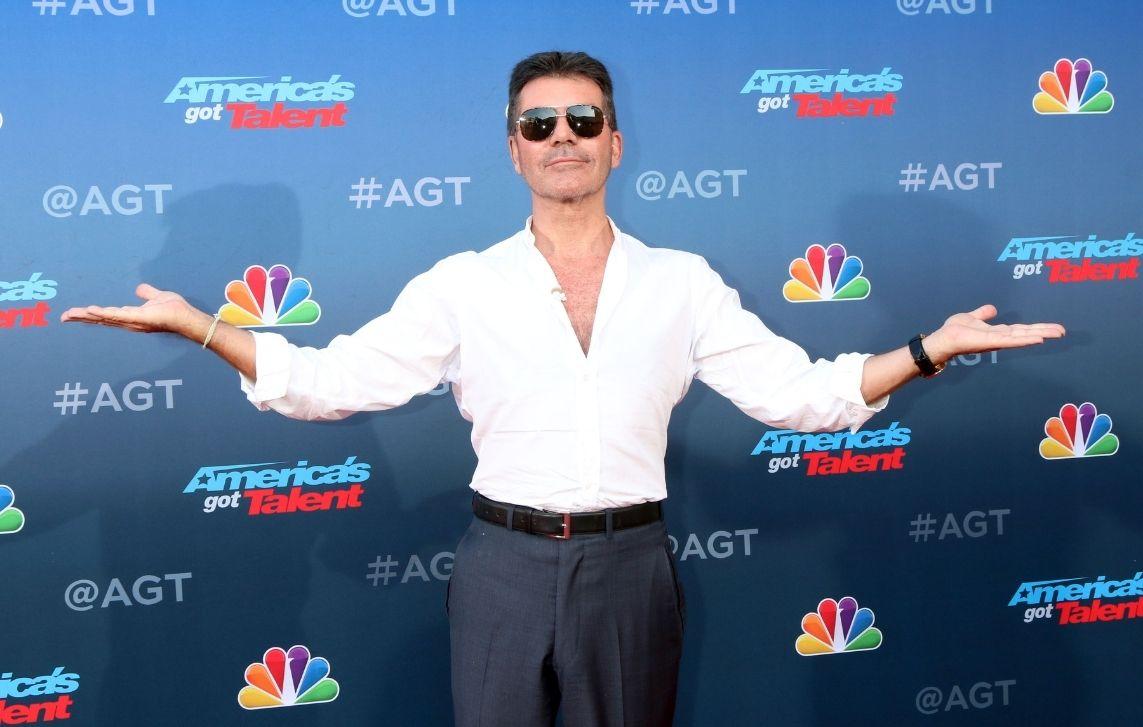 simon cowell breaks arm electric motorbike accident