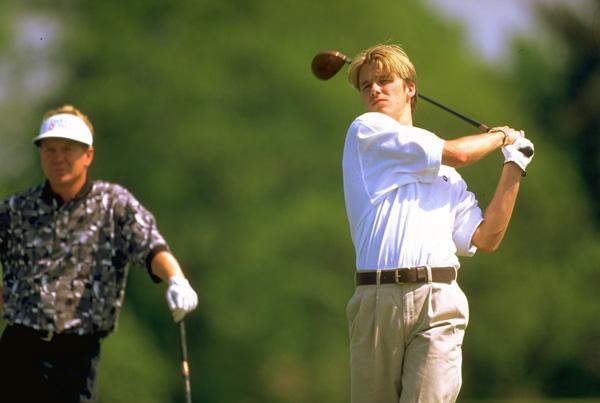 David Beckham of England is watched by Paul Broadhurst