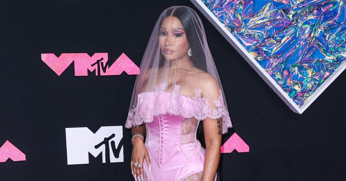 Nicki Minaj Channels Lil' Kim, Exposes Breast at Paris Fashion