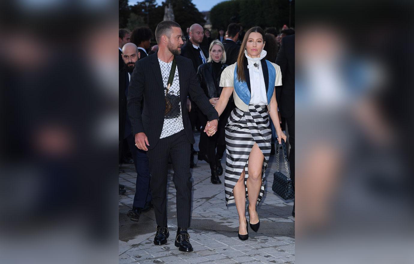 Justin Timberlake is TACKLED by a man who grabs his leg after he arrived to Louis  Vuitton show