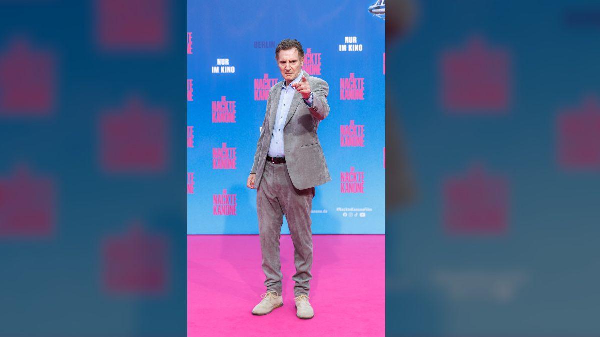 Image of Liam Neeson closely supports son Daniel Neeson.