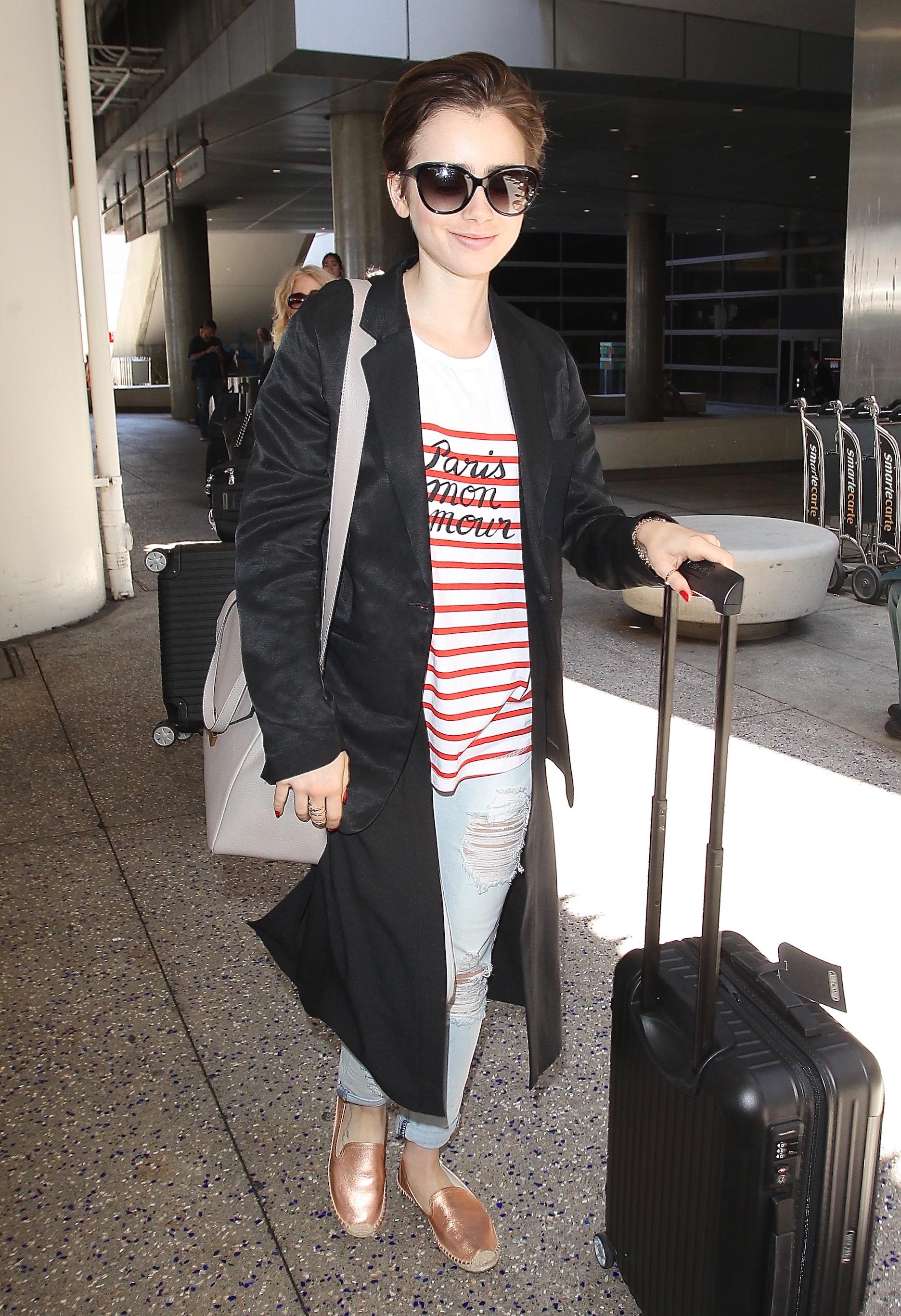 Lily Collins spotting arriving from Europe at LAX