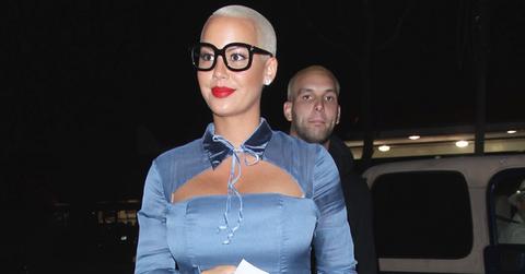 Amber Rose is seen at “Delilah’ Lounge in Los Angeles wearing a pair of black framed glasses and over the knee boots.