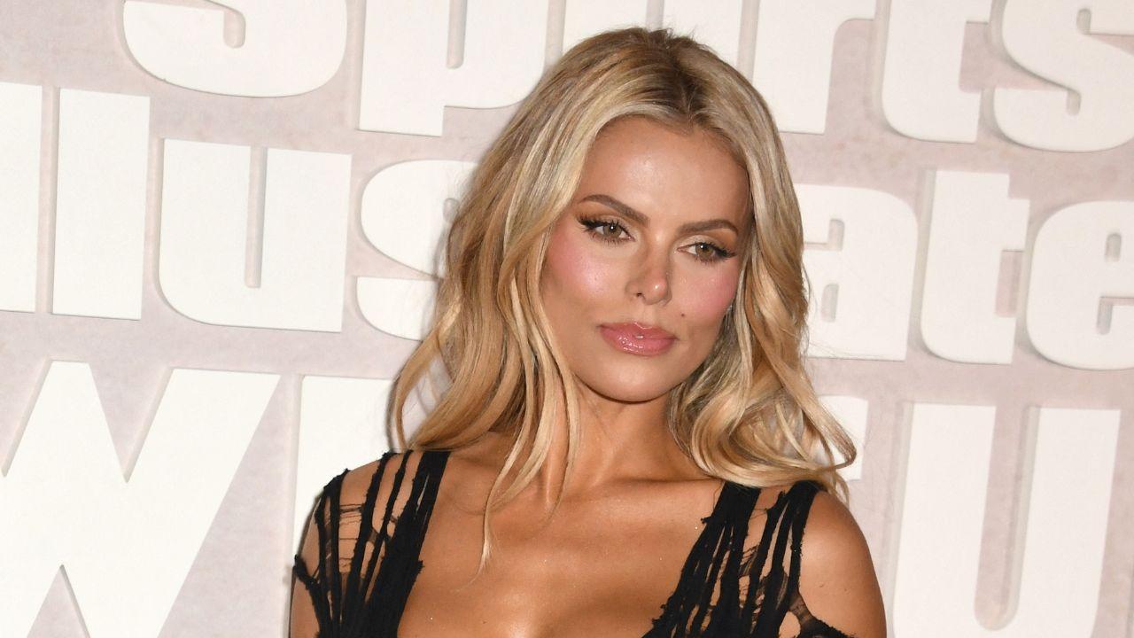 Image of Brooks Nader ditched her bikini top while out with her family.