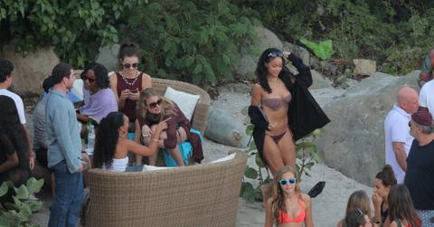 Rihanna seen partying on Shell Beach by Do Brasil beach bar