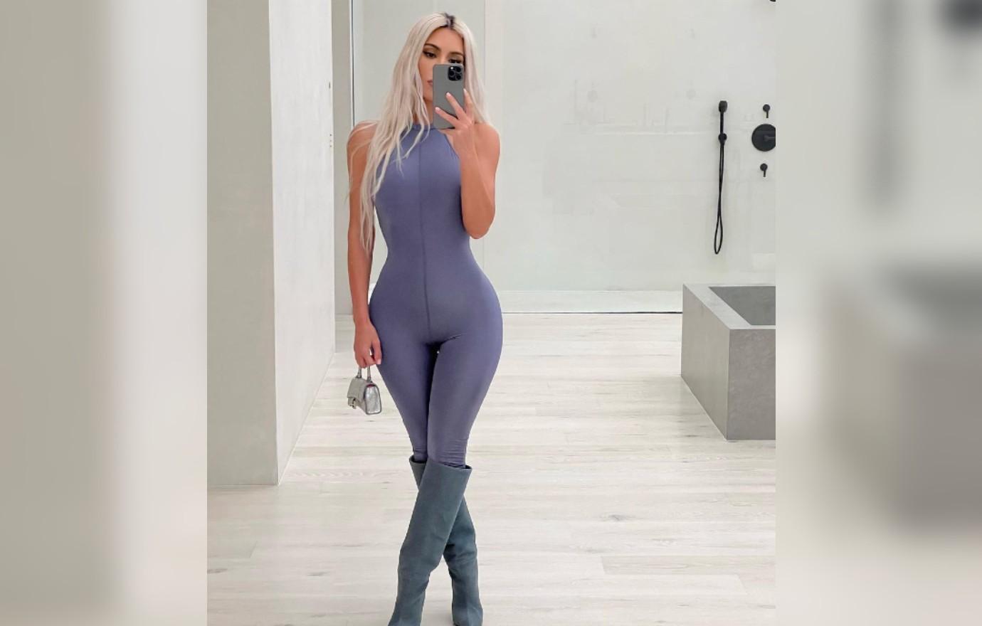 Kim Kardashian proudly flaunts famous curves in skimpy faux