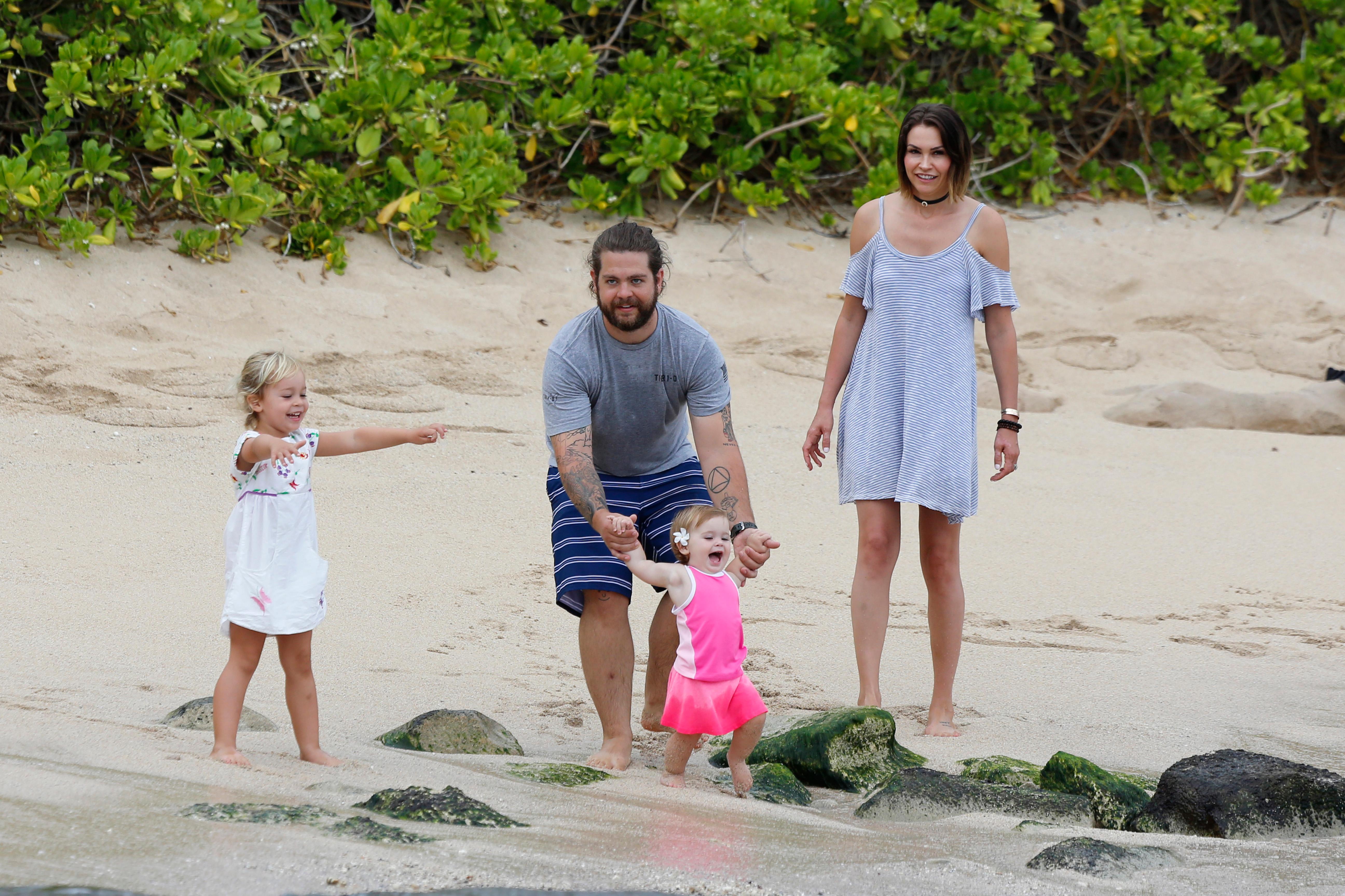 EXCLUSIVE: jack osbourne takes to the beach in Hawaii with his wife Lisa and children Pearl and Andy Rose