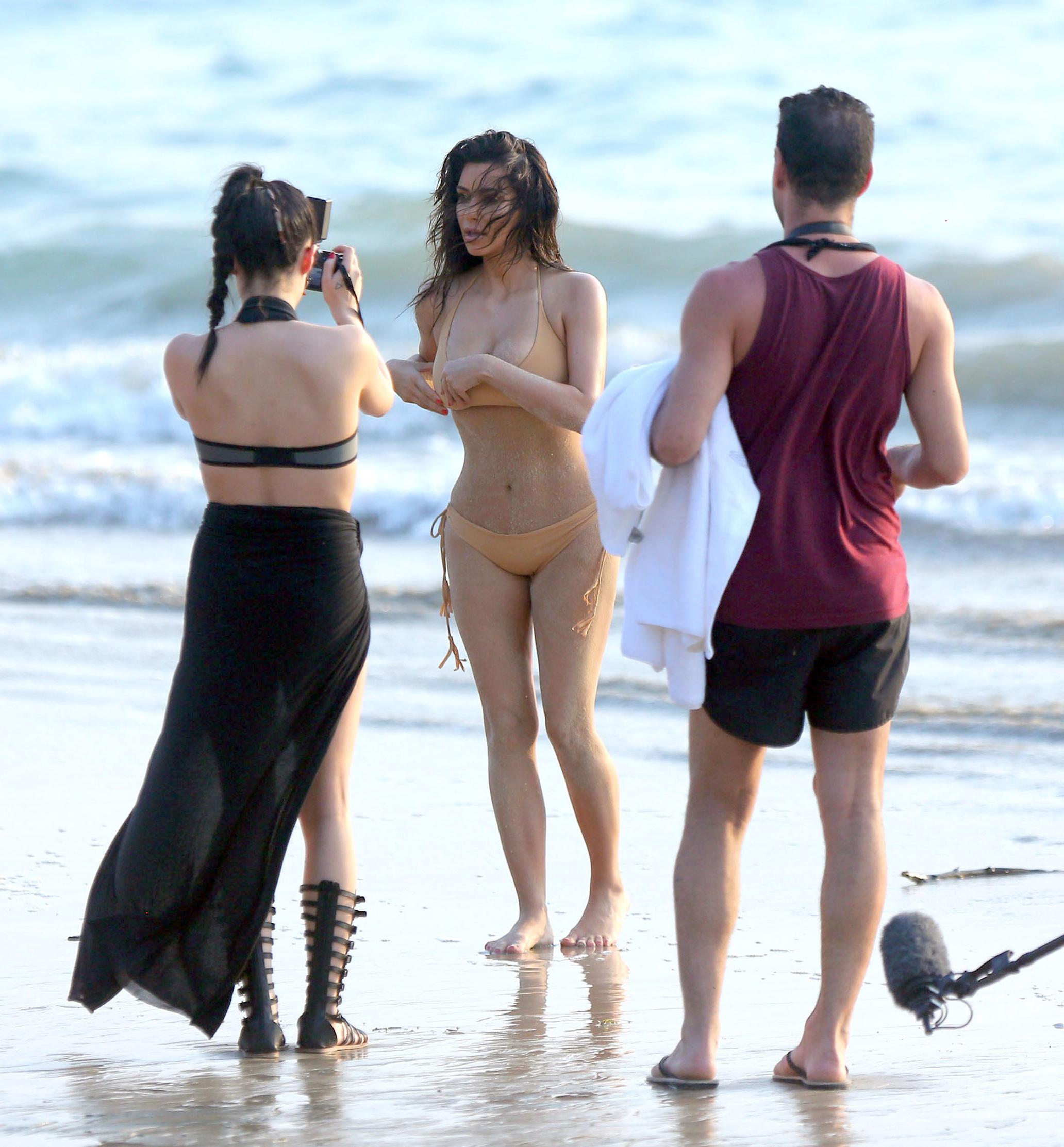 EXCLUSIVE: ***PREMIUM EXCLUSIVE***Kim Kardashian shows off her famous booty in a nude coloured bikini on a photo shoot in Thailand