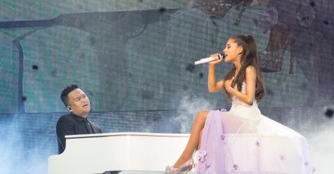 Ariana Grande looks elegant as she sings from on top of a piano on The Honeymoon Tour at the Forum in Inglewood, CA